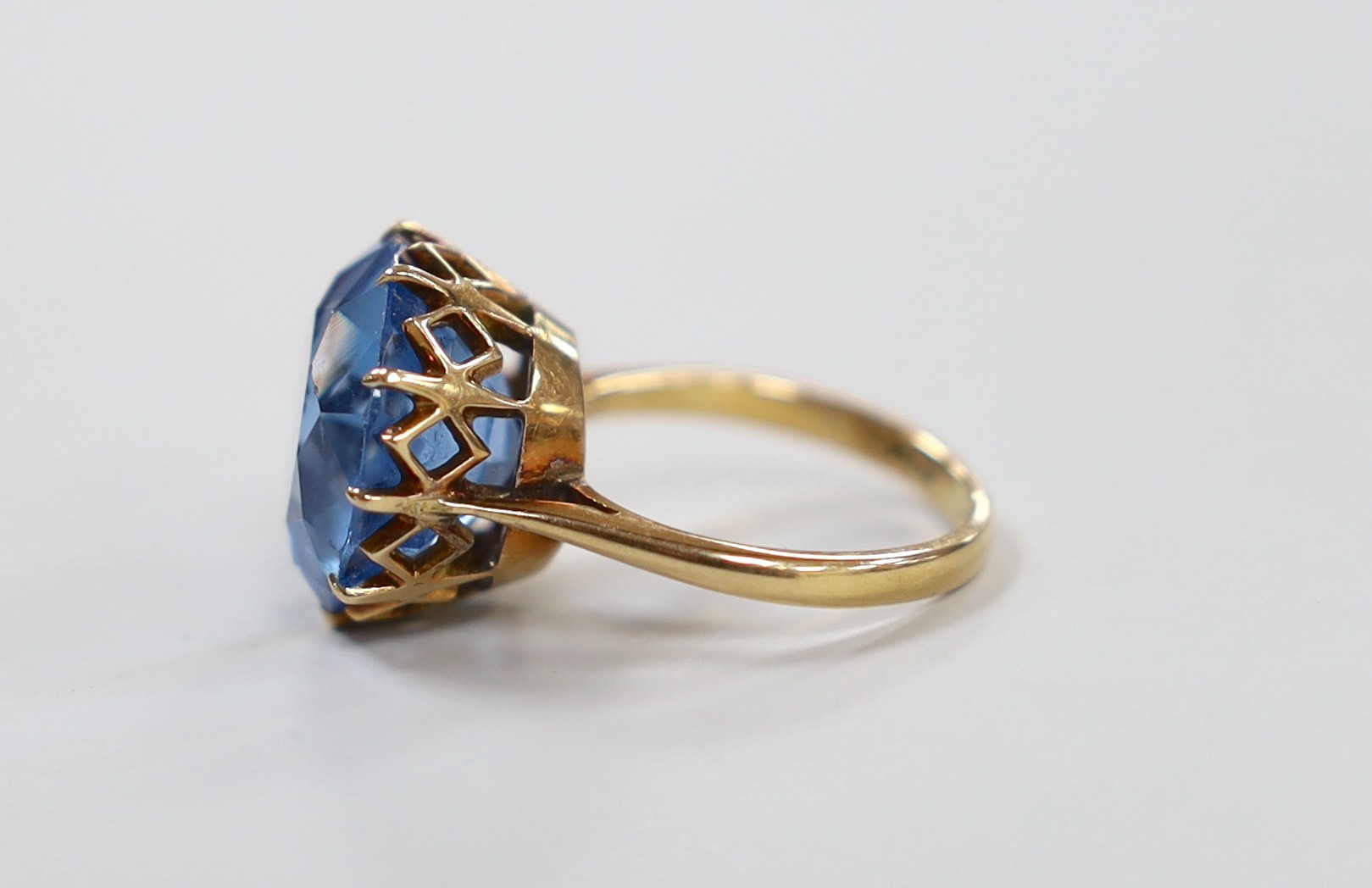 An 10k and blue paste? set ring, size K/L, gross weight 7 grams.